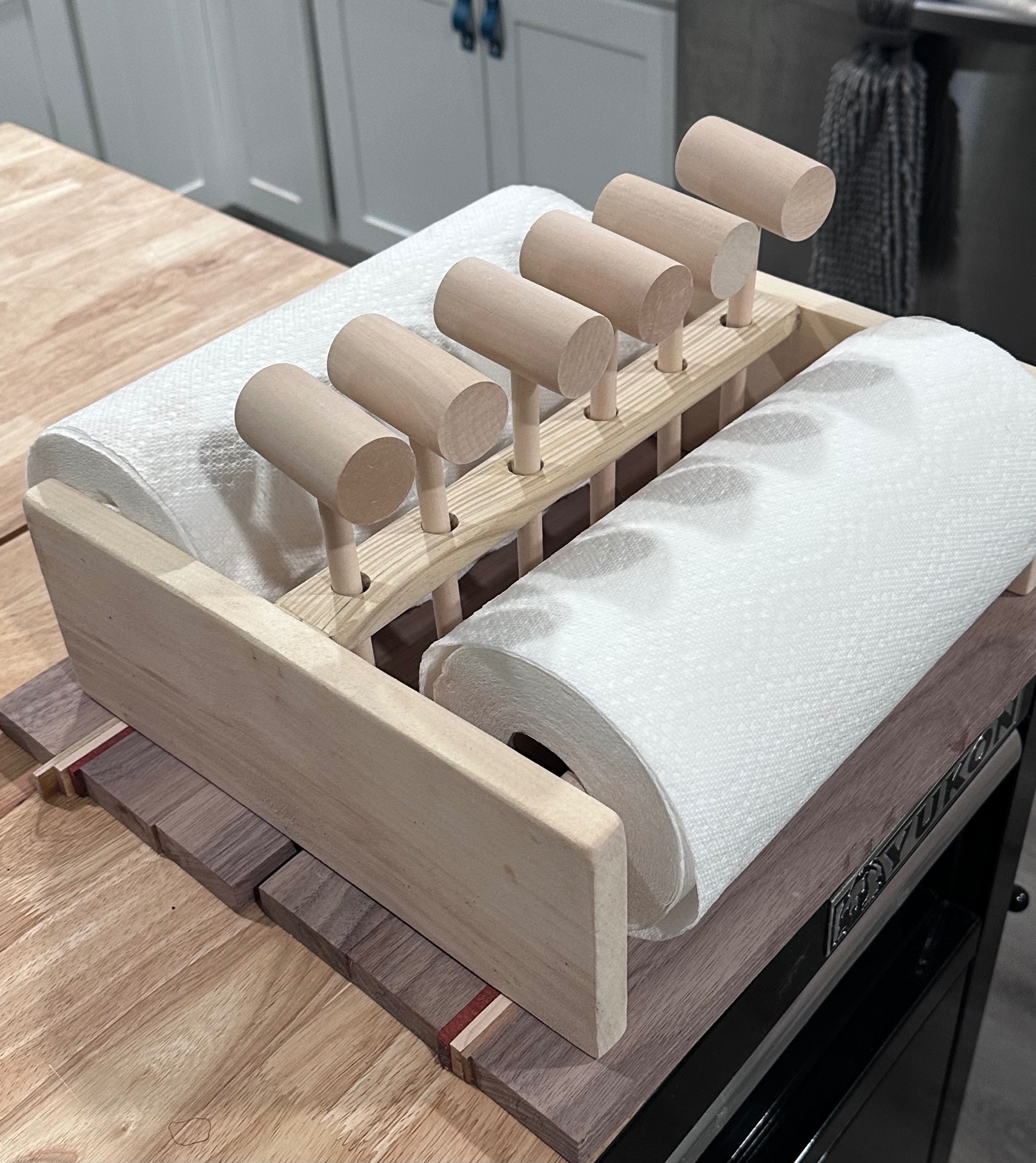 Handcrafted paper towel holder with wood dowel posts