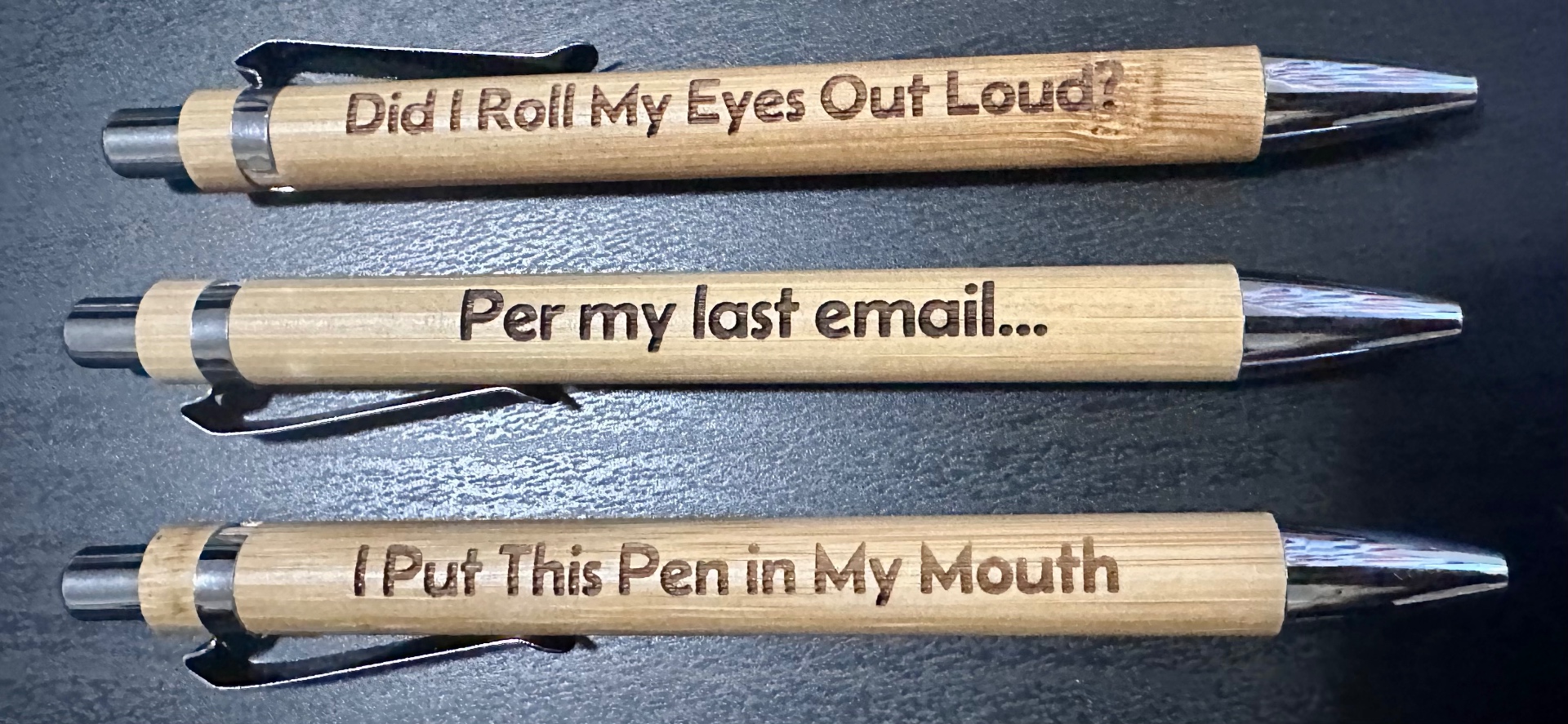 Three bamboo pens with engraved sayings