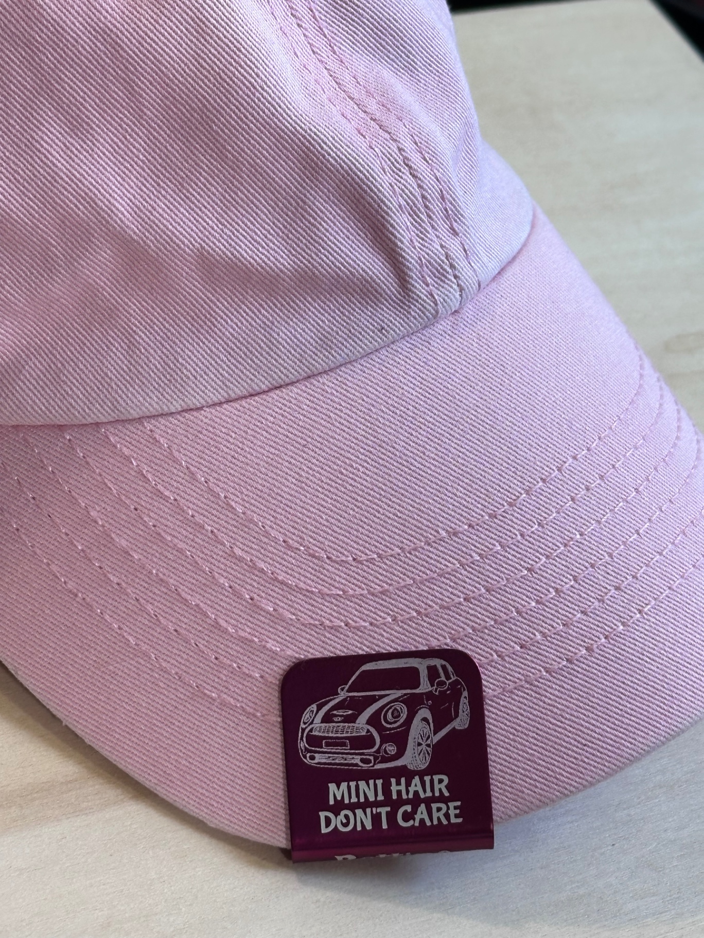 Pink cap with MINI Hair Don't Care engraved patch