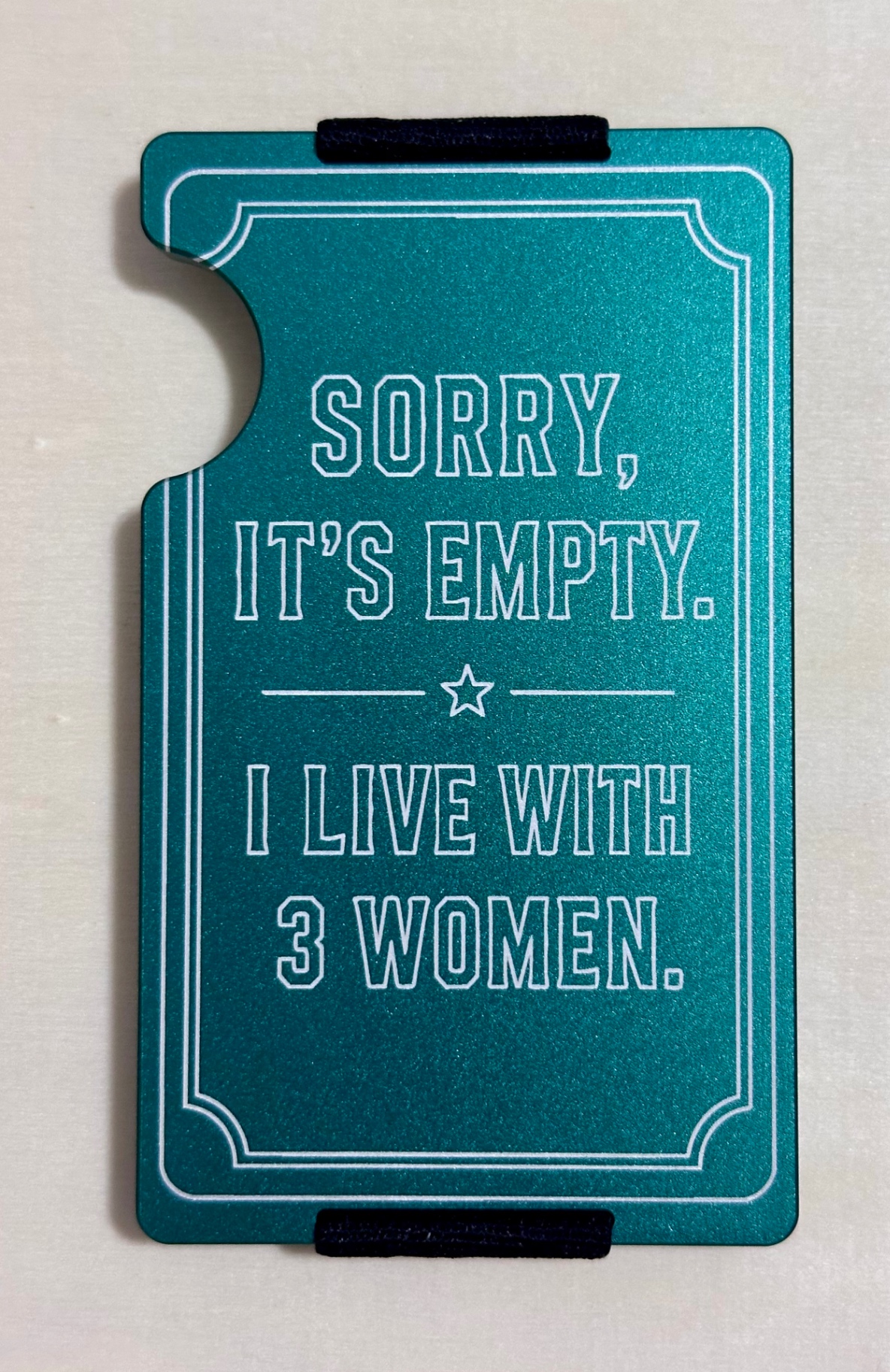 Engraved metal wallet with custom humorous message