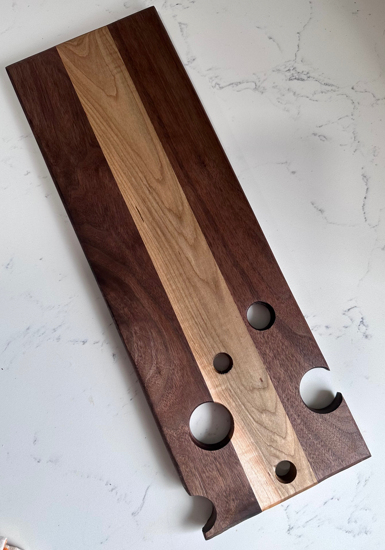 Walnut and maple wine flight board with glass cutouts