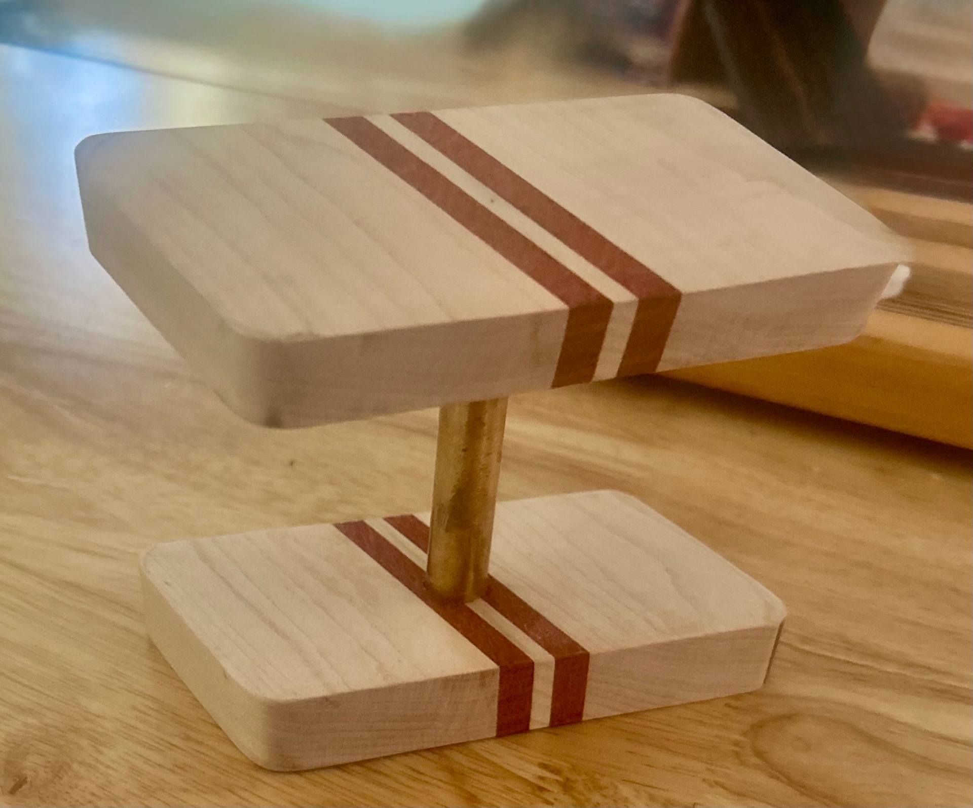 Handcrafted two-tier wood watch stand with contrasting inlay