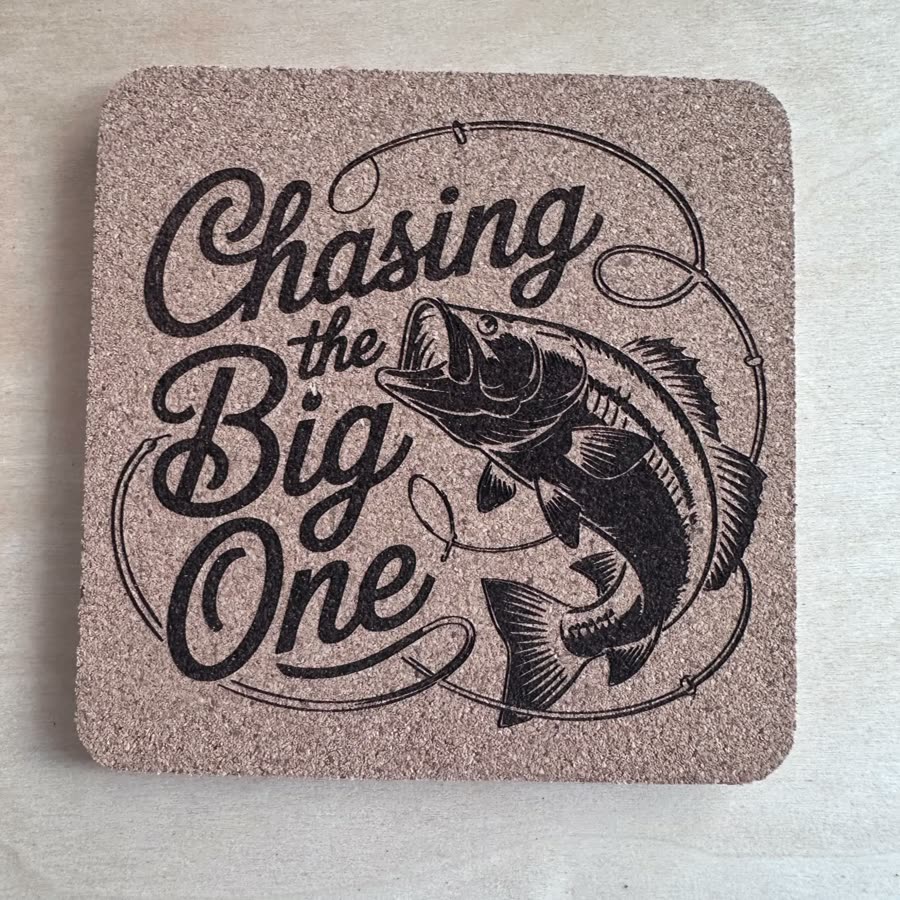 Square cork coaster engraved: Chasing the Big One, with a leaping bass